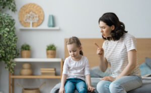 mother is scolding her child girl. family relationships